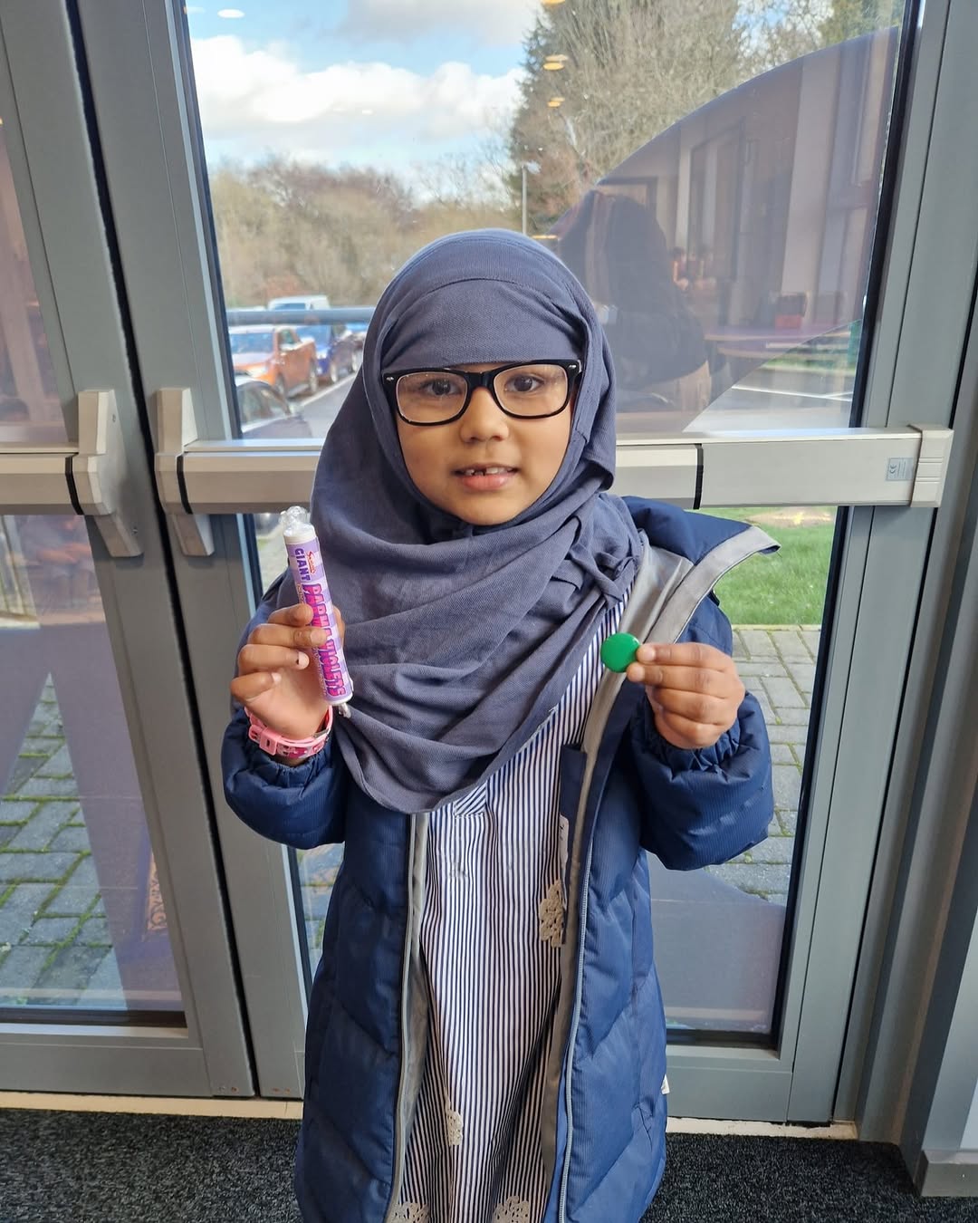 Fatima celebrating: Green badge